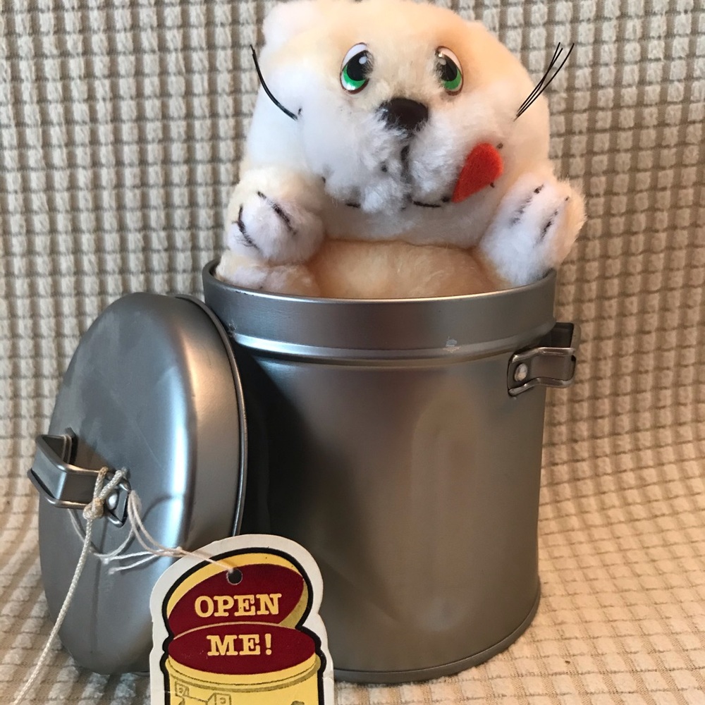 Cute stuffed animal cat in garbage can